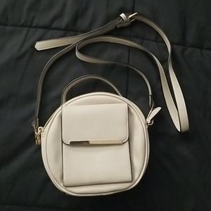Round beige crossbody purse